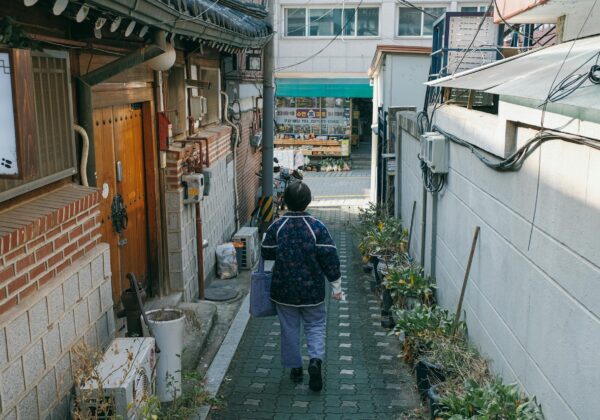 back view of a woman walking in the alley in bukchon hanok village seoul south korea